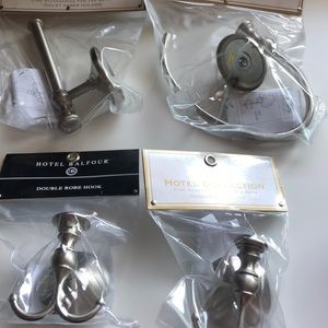 Remodeling? Updating? 2 robe/towel hooks hand towel, 1 TP holder, pewter.